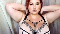 Big boobed Memphis masturbates in a bodystocking