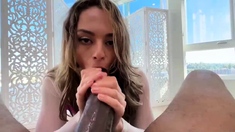 Big tit brunette sucks a big cock blowjob POV